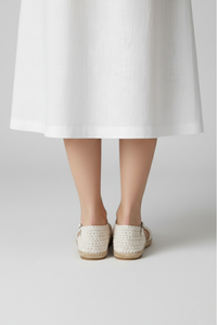 Vista trasera de sandalias St. Tropez tejidas a mano en crochet con suela plana | Claudia Bertolero